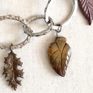 Carved stone and enamel leaf necklace